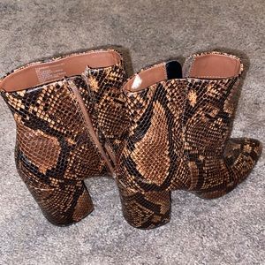 Steve Madden snake skin pointed boots with block heels.